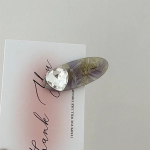 Oval marble-pattern acetate hair clip with heart rhinestone and France Handmade logo
