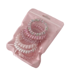 Set of 6 colorful gradient spiral hair ties in a pink translucent zip pouch storage