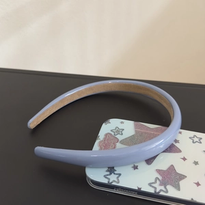 Detailed close-up of light purple leather headband with brown non-slip suede inner lining