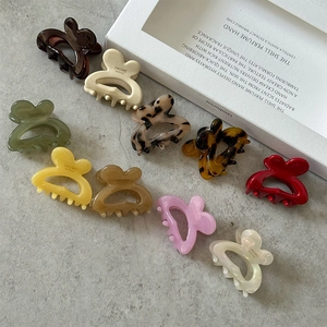 Colorful butterfly acetate hair claws set in various textures and marble patterns