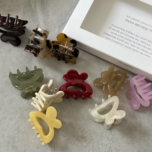Colorful acetate rabbit hair claw clips in various marble and tortoiseshell patterns
