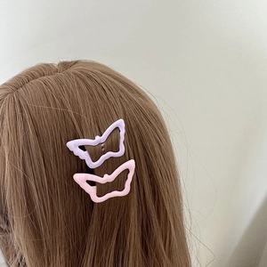 Pink and purple butterfly hair clips for women with a minimalist hollowed-out design