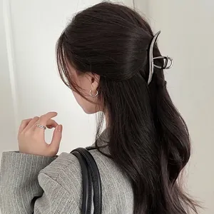 Minimalist silver wavy metal hair claw clip for elegant French style hair styling