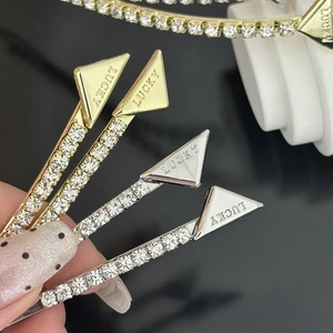 Set of four luxury rhinestone hair clips with Lucky engraved triangle metal tags