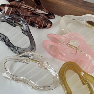 Set of large irregular resin claw clips in various colors with metallic gold springs