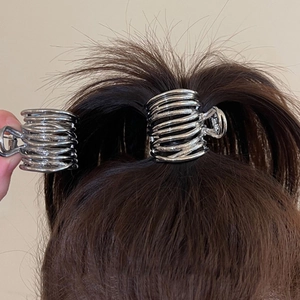 Sleek silver metal spiral hair claw clip for elegant ponytail styling and secure hair grip