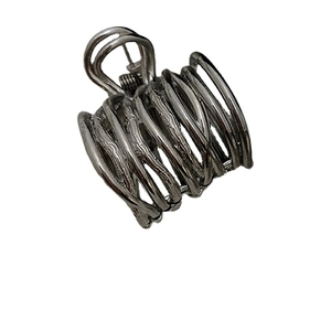 Minimalist silver metal spiral hair claw clip with a textured finish for high ponytails