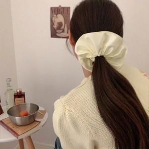 Elegant oversized cream satin scrunchie with pearl accents for high-elastic hair styling