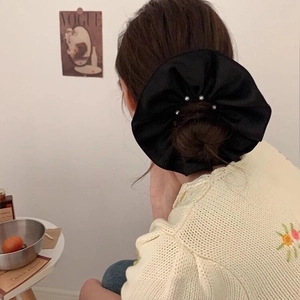 Elegant large black satin scrunchie with white pearls for bun hairstyle styling