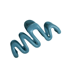 Glossy cyan wavy shark hair claw clip for elegant women hairstyles on white background