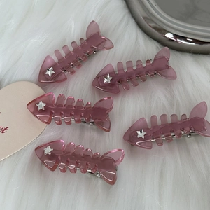 Set of 5 Y2K pink fishbone hair clips with silver stars on soft plush background