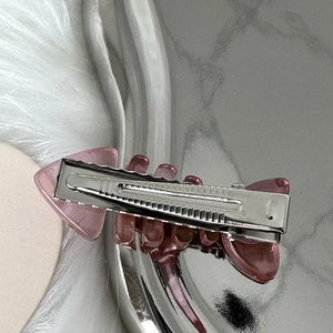 Y2K pink fishbone hair clip with silver metal duckbill base and resin finish