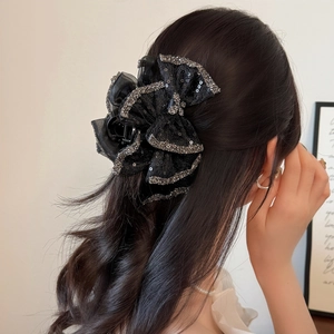 Elegant black lace bow hair claw clip with shimmering sequins for stylish women