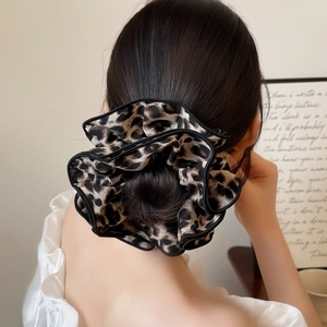 Leopard print four-layer scrunchie with black piping for high bun hairstyles