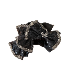 Elegant black bow hair claw clip with shimmering rhinestones and mesh fabric layers