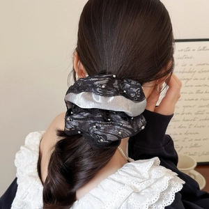 Elegant black lace scrunchie with white pearls for low ponytail hairstyles