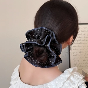 Black and white polka dot oversized scrunchie with blue denim ruffle trim for hair