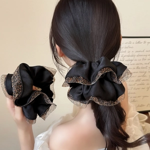 Elegant leopard print mesh scrunchie in black satin fabric for stylish ponytails