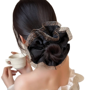 Elegant oversized leopard print scrunchie with black satin layers for chic ponytails