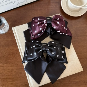 Polka dot satin bow hair clips in burgundy and black with premium glossy silk texture