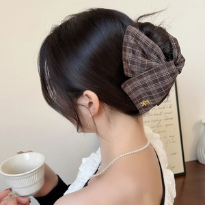 British style brown plaid bow hair claw clip with gold bee detail on model back view