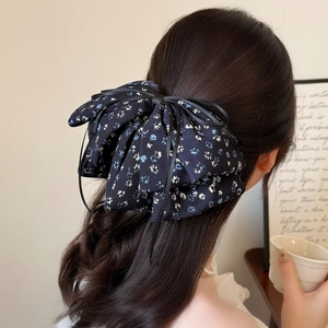 Elegant navy floral bow hair clip for women featuring artistic French style design