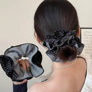 Checkered and polka dot fabric scrunchies for bun hairstyle in British academy style