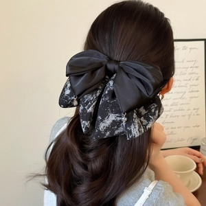 Elegant multi-layer ink print bow hair clip on model with sparkling crystal pendants