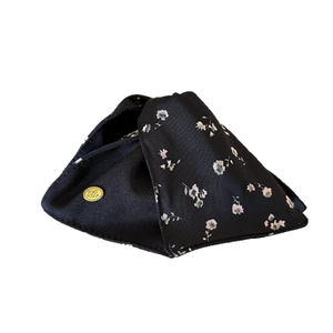Floral fabric shark hair claw clip in black satin with pink flowers and gold logo plate