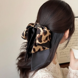 Elegant leopard print bow hair clip with ribbons and sparkling rhinestone center decoration