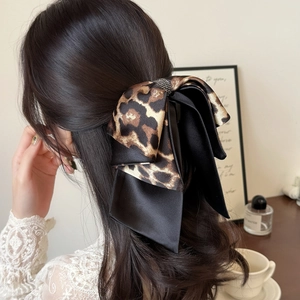 Elegant leopard print and black satin bow hair claw clip with rhinestones for women