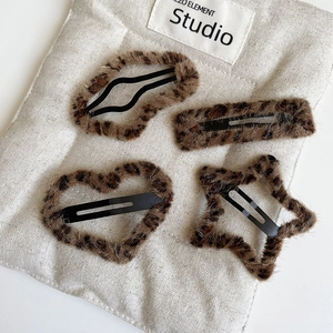 Set of four leopard print plush BB hair clips in heart star and rectangle shapes
