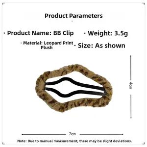 Detail view of plush leopard print BB clip showing 7cm length and soft faux fur texture