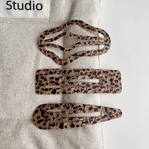 Three-piece leopard print metal BB hair clips in wavy, rectangular and teardrop shapes