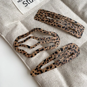 Three-piece leopard print hair clip set with rectangle, wavy, and teardrop designs