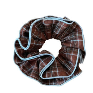 Brown plaid scrunchie with light blue trim in retro college style for ponytail styling