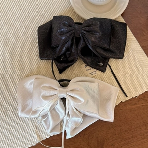 Elegant satin bow hair clip with streamers in black glitter and cream white finish