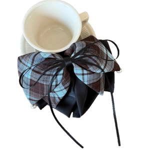Plaid bow hair claw clip with blue and brown checkered fabric and elegant pearl ribbon tassel