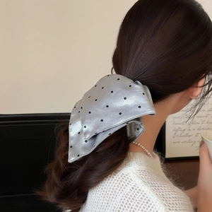 Polka dot silver grey satin hair scrunchie with bow tie design on female model