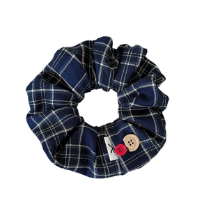 Navy blue plaid fabric scrunchie with colorful buttons and college style design
