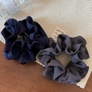 Set of two heart embroidered scrunchies in navy blue and grey with red stitch edge
