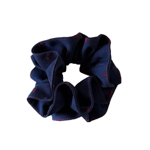 Navy blue heart polka dot scrunchie with red ruffled edges for elegant hairstyles