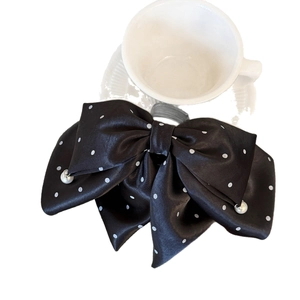 Polished black satin bow hair claw clip with white polka dots and pearl pendants