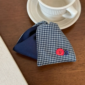 Close-up of blue plaid fabric hair claw clip with Faith & Hope engraved buttons