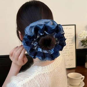 Blue plaid and lace scrunchie worn on a bun, showcasing a layered retro lazy-style design