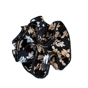 Black and white floral layered scrunchie with leaf pattern and ruffled trim for hair