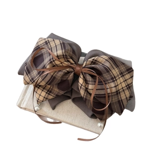 Elegant plaid bow hair claw clip with vintage brown checkered fabric and pearl detail