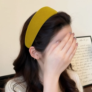 Elegant thick mustard yellow velvet headband for women showing high-top padded retro style
