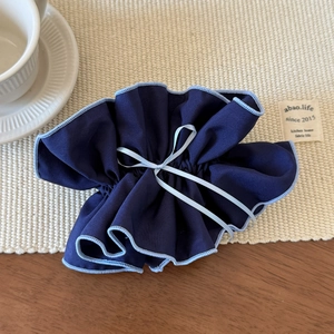 Navy blue checkered scrunchie with light blue ribbon bow and ballet style design