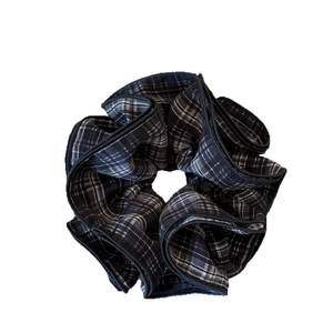 Elegant four-layer ruffled scrunchie with classic black and white plaid pattern edges